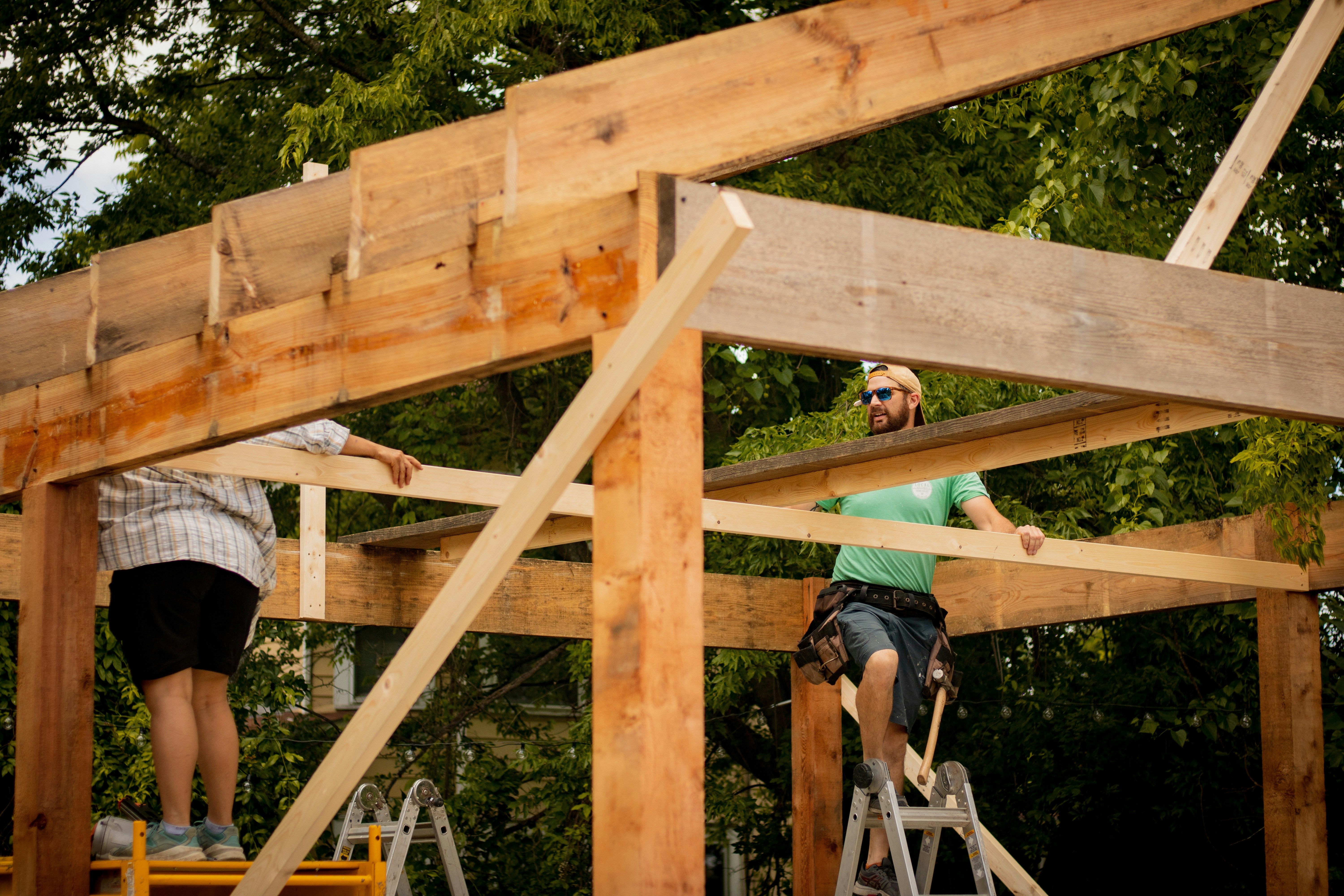 Crew assembling a timber frame structure